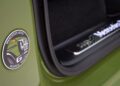 Close-up of the new unveiling: a Mercedes-Benz G-Class badge on a green car door, with a STRONGER THAN THE 1980s Mercedes-Benz-branded door sill visible in the background.