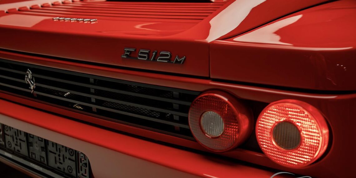 Rear view of a red Ferrari F512M, showcasing its dual circular taillights and model badge, ready to catch the eye at the Enthusiast Auction.