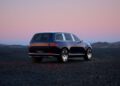 A modern Genesis SUV is parked on a rocky terrain at dusk, with a clear sky and mountains creating a perfect backdrop for the Blank Canvas Campaign.