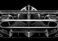White digital sketch of the Genesis GMR-001 Hypercar, front view, showcasing aerodynamic features, large air intakes, and a prominent rear wing on a black background—premiered at the New York International Auto Show.