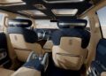 Luxurious Genesis X Gran Equator SUV interior with quilted leather seats, digital dashboard, panoramic sunroof, and desert landscape visible through the windows—an Off-Road Concept designed for adventure in style.