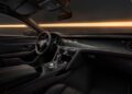 Discover the opulence of the Bentley Continental's interior—a masterpiece of design with a steering wheel, a dashboard adorned with multiple dials, and a gear lever. The Black Edition offers dark leather upholstery highlighted by orange stitching for an exquisite finish.