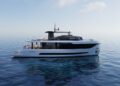 A modern Arcadia Yachts A80new with a black stripe floats on calm, clear blue water under a lightly clouded sky, embodying luxury and sustainability.