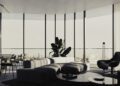 Modern living room with a large sectional sofa, armchair, coffee table, indoor plant, and floor-to-ceiling windows overlooking a city skyline—an elegant space inspired by luxury real estate on BRABUS Island in Abu Dhabi.