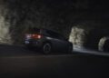 A BRABUS-tuned, dark-colored SUV glides through a dimly lit tunnel, its 637HP engine purring as the illuminated rear lights cut through the shadows.