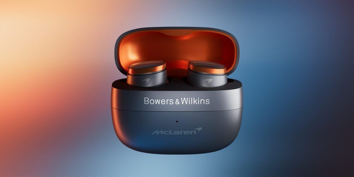Bowers & Wilkins earbuds in a black and orange case with McLaren branding, set against a gradient background.
