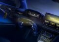 Futuristic Denza Z sportscar dashboard with digital displays, a touchscreen center console, and illuminated controls on the steering wheel.