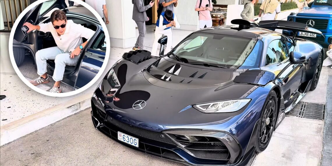 A man exits a car as people gather to take photos of a parked blue Mercedes-AMG One sports car on the street in Monaco, possibly hoping to spot George Russell nearby.