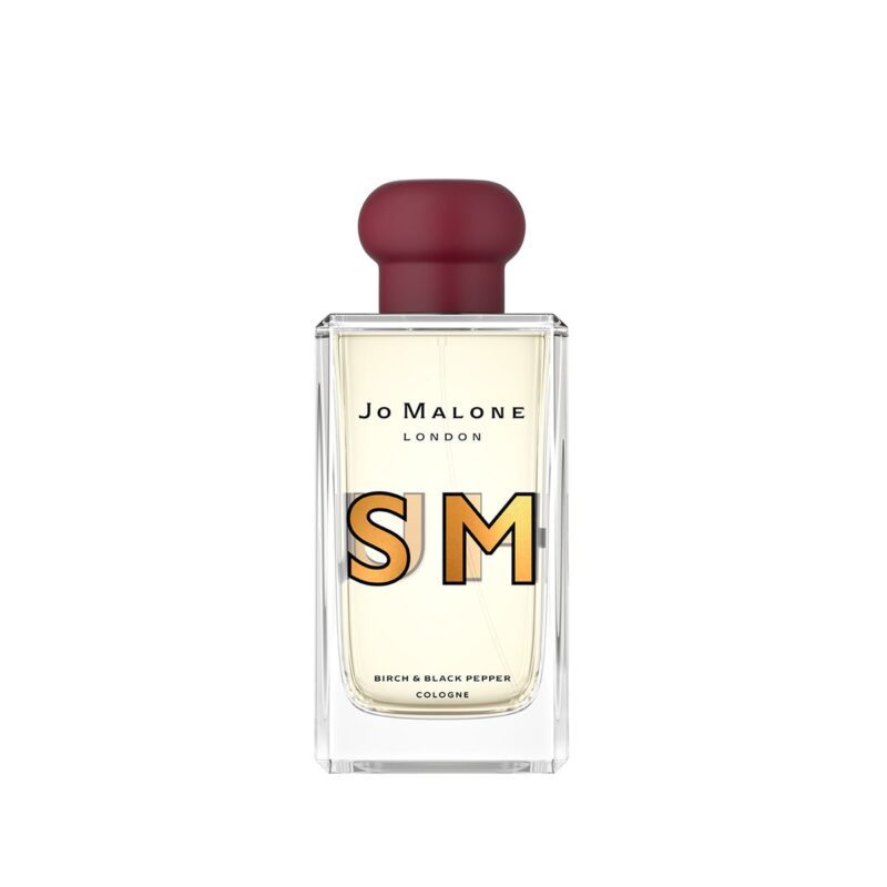 A bottle of Jo Malone London cologne labeled "Birch & Black Pepper," with large stylized letters "S M" on the front and a maroon cap—a true style upgrade and a must-have for those seeking luxury accessories.