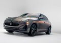 A metallic Maserati sports SUV is parked in a brightly lit studio, showcasing its sleek design and polished exterior, echoing the elegance one might expect at Milan Design Week.