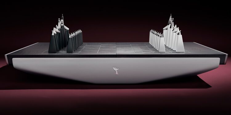 A bespoke chess set featuring abstract, angular black and white pieces on a minimalist rectangular board, viewed from the side against a dark background—an ultra-luxury design reminiscent of Rolls-Royce sophistication.