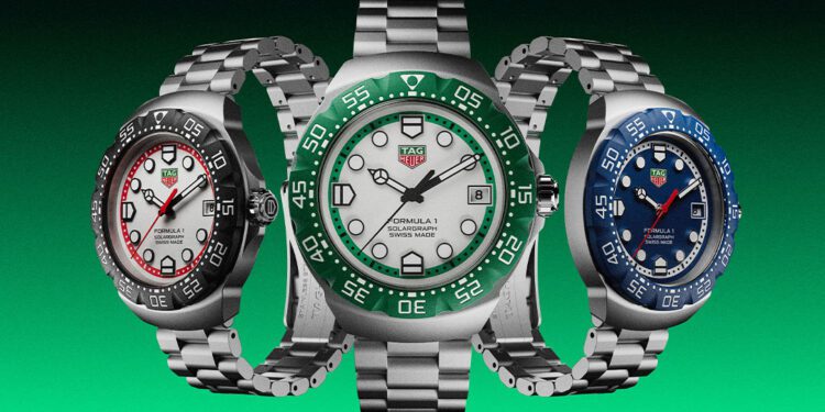 Three TAG Heuer metallic wristwatches with round faces and chain-link bands are displayed against a green gradient background. Each watch, reminiscent of the vibrant hues found in motorsport, features unique accent colors: red, green, and blue.