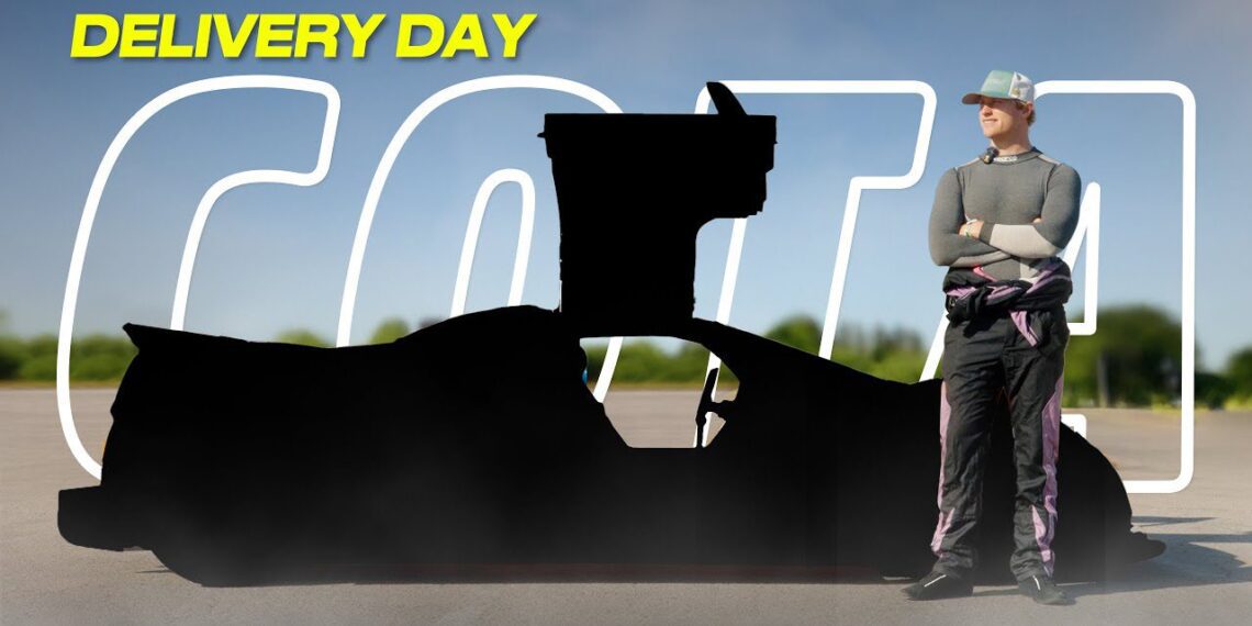 A person in racing gear stands beside a black-silhouetted Gumpert Apollo on a sunny "DELIVERY DAY"—ready to hit COTA as a U.S. street legal supercar.
