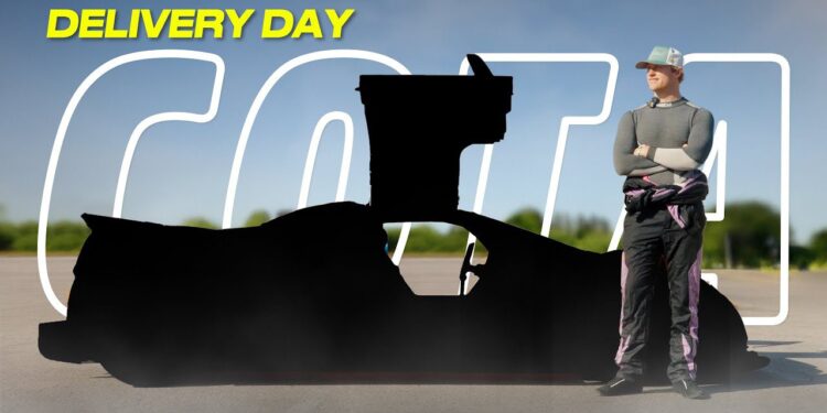 A person in racing gear stands beside a black-silhouetted Gumpert Apollo on a sunny "DELIVERY DAY"—ready to hit COTA as a U.S. street legal supercar.