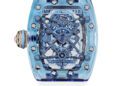A luxury Richard Mille watch from the Sapphire Collection, featuring a blue transparent case, visible internal mechanisms, and a white strap, photographed against a white background.
