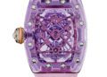 A luxury Richard Mille RM 75-01 watch from the Sapphire Collection with a transparent purple case, skeleton dial, and light pink strap, showcasing visible mechanical components and “SWISS MADE” text.