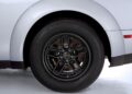 Close-up view of a 2023 Dodge Challenger SRT Demon 170 rear wheel and tire against a white background, showcasing the distinctive rim, brake components, and part of the fender—a must-see for any MOPAR enthusiast eyeing a Dodge Demon 170 for sale.