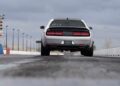 A gray 2023 Dodge Challenger SRT Demon 170 on a drag strip, its tires lifting off the ground under a cloudy sky—a crown jewel no MOPAR collector can ignore. Dodge Demon 170 for sale.