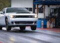 A 2023 Dodge Challenger SRT Demon 170 lifts its front wheels off the ground as it accelerates on a drag strip—a crown jewel no MOPAR collector can ignore.