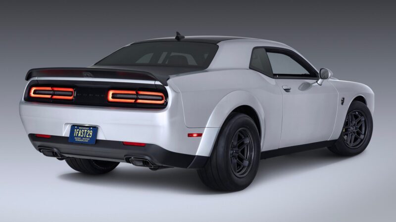 A white 2023 Dodge Challenger SRT Demon 170 viewed from the rear three-quarter angle, showcasing its wide body, black rear spoiler, and distinctive taillights—a crown jewel no MOPAR collector can ignore.