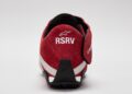 Red STARLINE Sneaker viewed from the back, featuring "RSRV" text and a logo on the heel, inspired by F1 DNA with a white and black sole on a plain background.