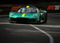 A green and black Aston Martin sports car with yellow accents drives on a racetrack, with "F1 75" signage visible in the background, reminiscent of the excitement at the Monaco Grand Prix.