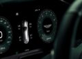Digital car dashboard displays speedometer, tire pressure indicators, temperature, mileage, Sport mode, and Aston Martin logo—as Aston Martin becomes first automaker to debut Apple CarPlay Ultra.