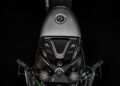 Top-down view of the Carbon-Clad Concept BMW Motorrad’s fuel tank, handlebars, and control panel showcases the next-generation of RR against a striking black background.