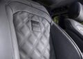 Close-up of a luxury car seat with quilted leather upholstery, a BRABUS Masterpiece plaque, and exclusive details crafted for the G 63.