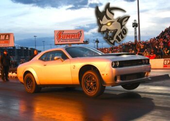A silver 2023 Dodge Challenger SRT Demon 170 launches from a drag strip, front wheels lifted, with a crowd in the background and a Demon 170 logo above—a crown jewel no MOPAR collector can ignore. Dodge Demon 170 for sale.