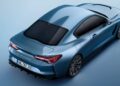 Metallic blue Bavarian-Italian GT sports coupe viewed from above and behind, showcasing sleek aerodynamic lines, black roof, tinted windows, and distinctive rear LED lights with a European license plate.