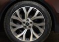 Close-up of a silver multi-spoke alloy car wheel with a Land Rover logo in the center, fitted with a Pirelli Scorpion Zero tire, marking 35 years of Discovery with the Gemini and Tempest Special Editions.