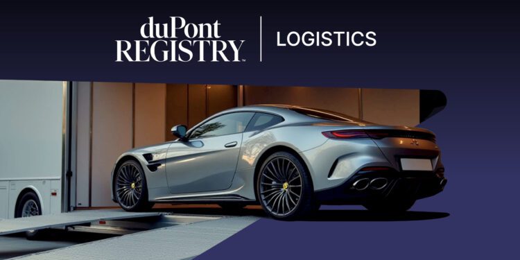 A silver luxury sports car is being loaded onto an enclosed vehicle transporter with a duPont REGISTRY Logistics banner above, exemplifying premium Luxury Vehicle Transport.
