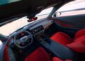 Interior view of the Four-Door Dodge Charger Daytona is here, showcasing a modern sports car with a digital dashboard, touchscreen display, black and red seats, and a leather-wrapped steering wheel—there's more to this muscle car sedan than meets the eye.