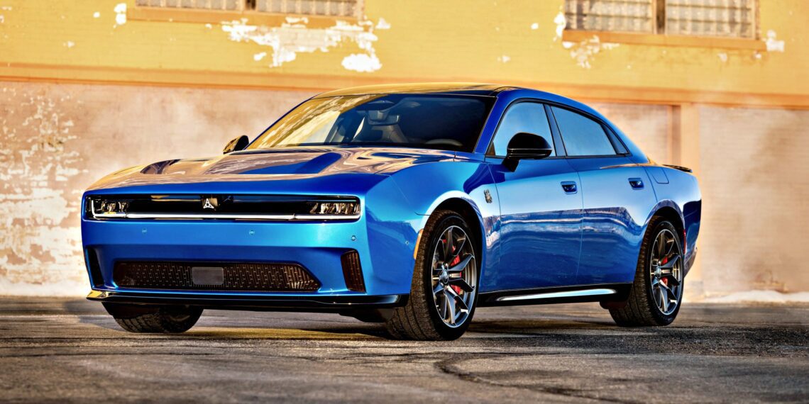 A blue modern sports sedan, inspired by the Four-Door Dodge Charger Daytona, with a sleek design is parked in front of a textured, yellow-painted brick wall—there's more to this muscle car sedan than meets the eye.