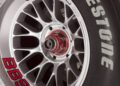 Close-up of a silver BBS alloy wheel with a red center lock and a Firestone tire, reminiscent of the style seen on icons like the Ferrari F2001 from the Historic Monaco Sale, where it became the most valuable Schumacher-F1 car at €15.98 million.