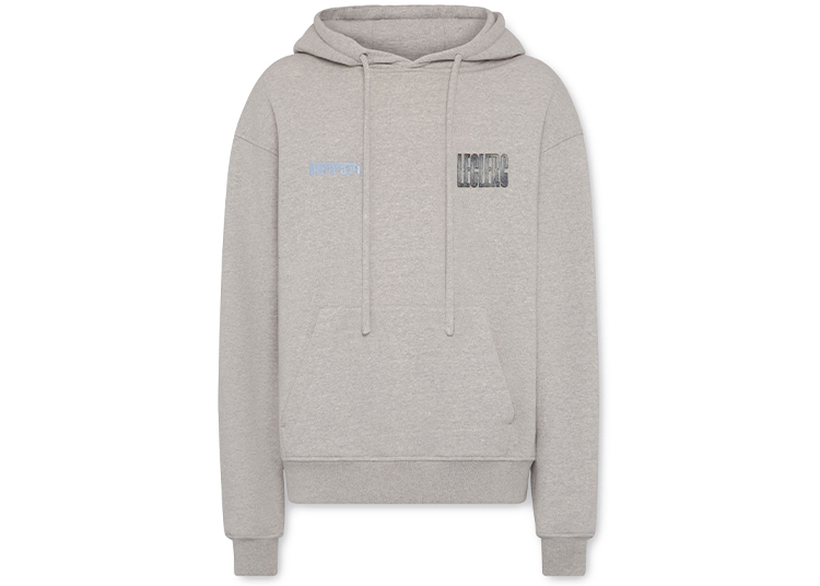Light gray hooded sweatshirt with front pocket and drawstrings, featuring small text on the left chest and larger "LEGENDS" text on the right chest; part of the Lifestyle Capsule Collection inspired by Charles Leclerc and Ferrari.