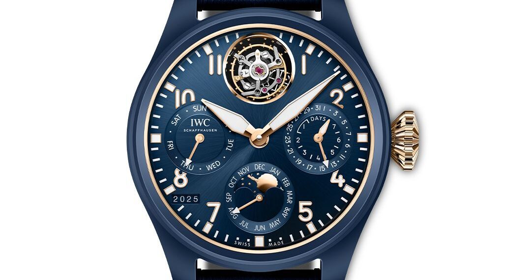 A blue IWC Schaffhausen wristwatch with gold accents showcasing the time, day, date, month, year, power reserve, and a striking tourbillon at 12 o’clock—a perfect blend of luxury and precision from the Tourbillon Pilot's Watches collection.
