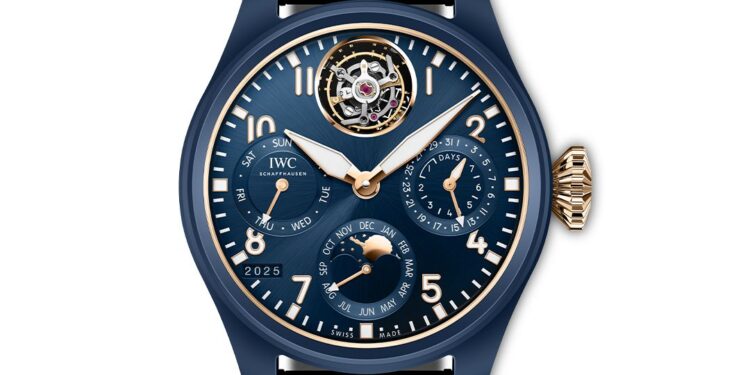 A blue IWC Schaffhausen wristwatch with gold accents showcasing the time, day, date, month, year, power reserve, and a striking tourbillon at 12 o’clock—a perfect blend of luxury and precision from the Tourbillon Pilot's Watches collection.