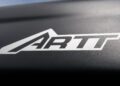 Close-up of a black carbon-fiber surface with "ARTT" in bold white letters, the "A" stylized as a mountain peak—hinting at one thing that makes this tent a game changer for the Jeep Wrangler.