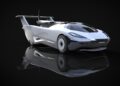 The production prototype of Klein Vision AirCar breaks cover—a sleek white flying car with large rear wings and a glass canopy, showcased on a glossy black surface with its reflection beautifully visible.