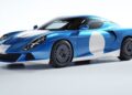 A blue and white Zagato AGTZ Twin-Tail #2 sports car with a low, aerodynamic profile, round headlights, and distinctive circular patterns on the doors and hood, parked on a plain white background—now part of Christian Von Koenigsegg's car collection.