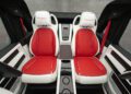 The image shows two red and white leather car seats with "MANSORY" branding, separated by a central console with carbon fiber accents inside a luxurious Speranza G-Class Convertible.
