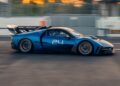 A blue Maserati MCXtrema race car with the number 24 drives on a racetrack, motion blurred background—Maserati to take the spotlight at 2025 FuoriConcorso with GT2 Stradale and MCXtrema.