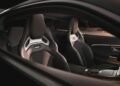 View of two black sport car bucket seats with silver accents, seen through the side window of a limited-run Mercedes-AMG GT 63, showcasing the car's modern and minimalist interior design.
