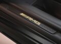 Close-up of a car door sill with illuminated "AMG" branding, hinting at a limited-run Mercedes-AMG GT 63 much like the one featured in the Brad Pitt F1 film.