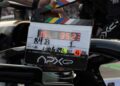 A film crew member holds a clapperboard labeled “APX GP” near a Mercedes-AMG GT 63, marking details for the Brad Pitt F1 film, including scene number, take, and the date 2024-10-26.