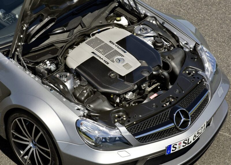 Overhead view of a silver Mercedes-Benz car with its hood open, revealing an AMG-branded engine—The Only Mercedes-AMG Black Series To Feature A V12.