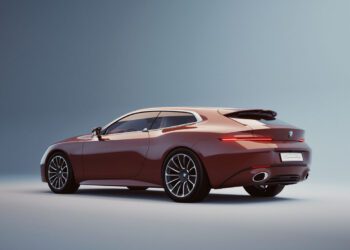 A sleek, red BMW Speedtop sports wagon with tinted windows and modern alloy wheels is shown against a plain, light gradient background.