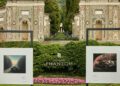 Two framed car photographs on display outdoors with elaborate stone architecture, lush greenery, and a prominent Rolls-Royce Phantom logo in the center background evoke the elegance of Villa d'Este.